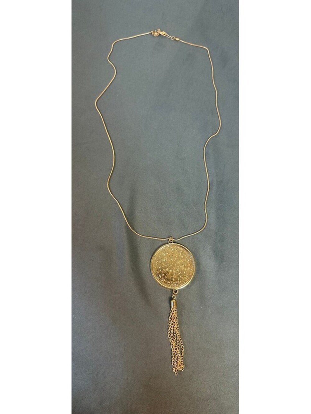 Gold Round Pendant With Tassels